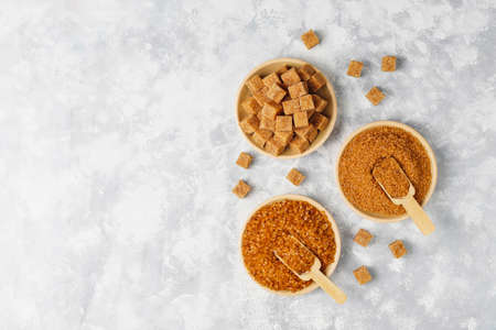 Various types of brown sugar on concrete background,top viewの写真素材