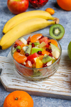 Fresh fruit salad in the bowl with fresh fruits.