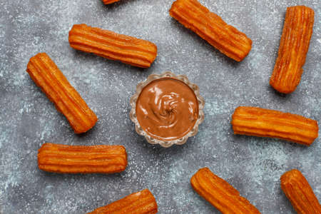 Traditional Mexican dessert churros with chocolate,top viewの写真素材