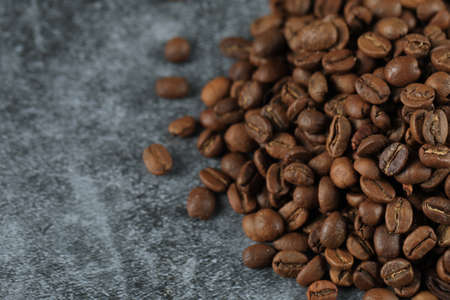 Fresh coffee beans for wholesale, on the right side of the backgroundの写真素材