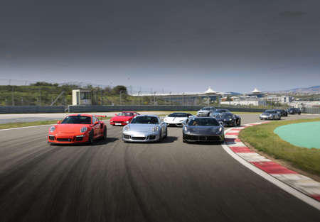 Multiple sport cars racing on the traceの写真素材