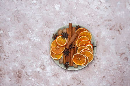 Mulled wine recipe ingredients on brown concrete background ,christmas or winter warming drink.の写真素材