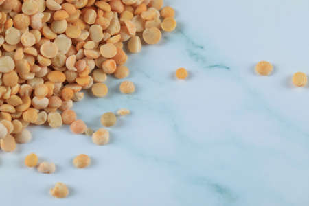 Yellow fresh and healthy beans on blue marbleの写真素材