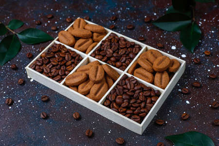 Composition with roasted coffee beans and coffe bean shaped cookies