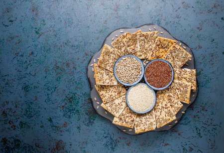 Snack cookies with sunflower seed,linen seed,sesame seeds on grey background,top viewの写真素材