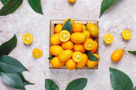 Flat lay of kumquats on a concrete background. Top viewの写真素材