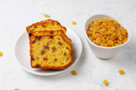 Traditional raisin cake slices with raisin on light background,top view