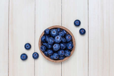 natural blueberries on light brown background,top view,copy space