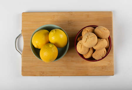Lemon and butter cookies on a wooden board. top viewの写真素材