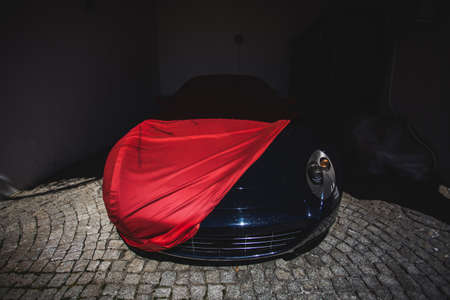 Red cover tissue on a black sport car