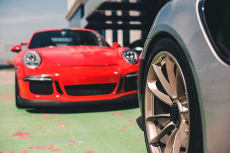 Brand new red sport car in parking modeの写真素材