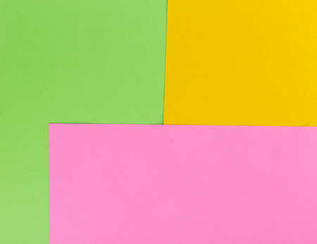 Green, pink and orange color papers backgroundの写真素材