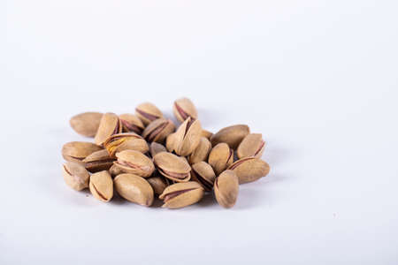 Pistachios on the center of a white background