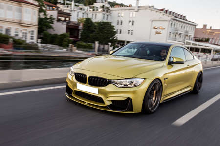 Golden luxury sport sedan high speed driveの写真素材