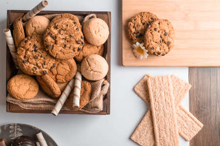 Cookie box with waffles on a wooden board
