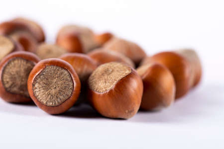 Nuts isolated on white background with shadows underneathの写真素材