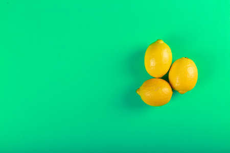 Lemons on a green backgroundの写真素材
