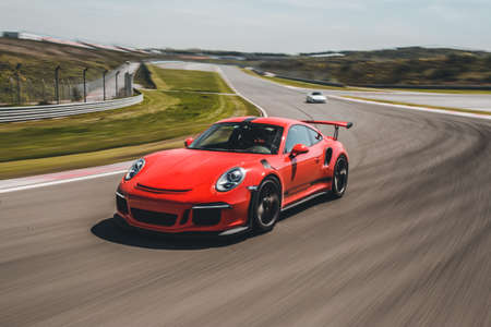 Red brand sport car high speed driveの写真素材
