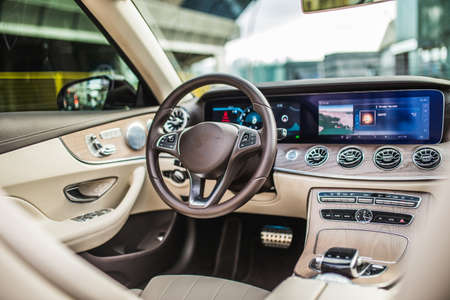 Car interior, driver seat, navigation, speed and fuel meters and AC