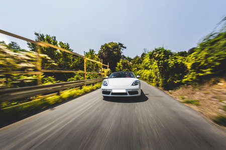 White sport cabriolet drive in the nature