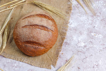 Different kinds of fresh bread as background, top viewの写真素材