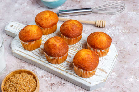 Cupcake baking background with kitchen utensils.
