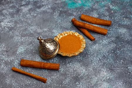 Assorted spices on light background.Curry, paprika, pepper,coriander,cinnamon sticks,dry roses,...