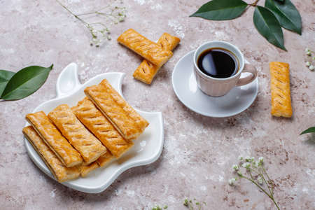 Apple puff pastry cookies in apple shape plate with fresh apples ,top viewの写真素材