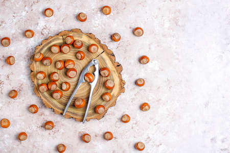 Hazelnuts on concrete background,top view