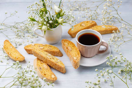 Italian tuscan traditional cookies cantuccini with almonds ,a cup of coffee on light background,top viewの写真素材