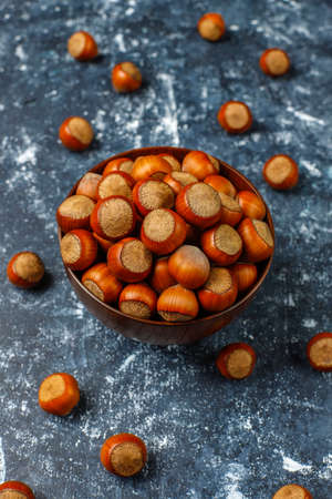 Hazelnuts on concrete background,top view