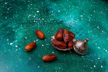 Beautiful bowl full of date fruits symbolizing Ramadan,top viewの写真素材