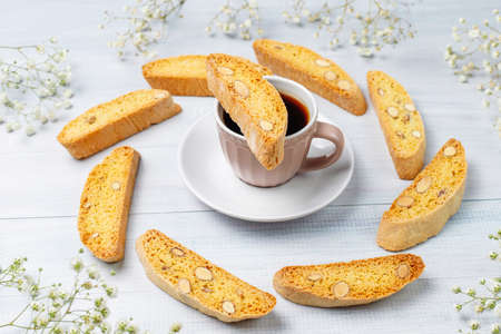 Italian tuscan traditional cookies cantuccini with almonds ,a cup of coffee on light background,top viewの写真素材