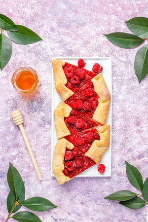 Open pie, raspberry galette. Summer berry dessert.の写真素材