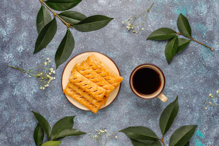 Apple puff pastry cookies in apple shape plate with fresh apples ,top viewの写真素材