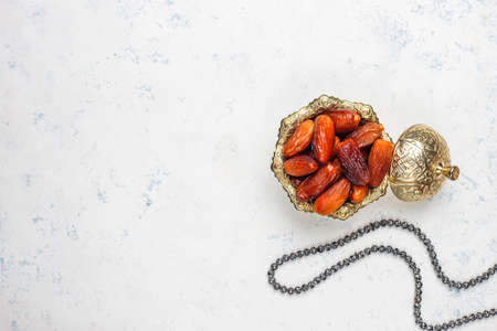 Beautiful bowl full of date fruits symbolizing Ramadan,top view