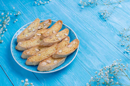 Italian tuscan traditional cookies cantuccini with almonds ,a cup of coffee on light background,top...