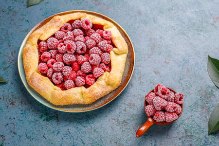 Open pie, raspberry galette. Summer berry dessert.