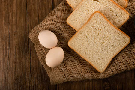 Slices of white bread and eggs