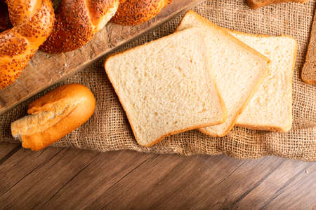 Slices of white bread with bagels and baguette
