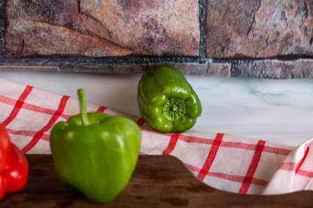 Green chili peppers on the marble
