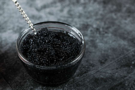 Black caviar, seafood in a small jar with a spoon insideの写真素材