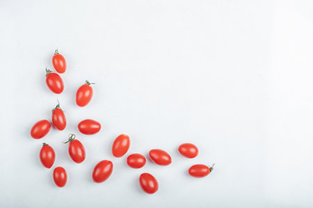 Organic cherry tomatoes on white backgroundの写真素材