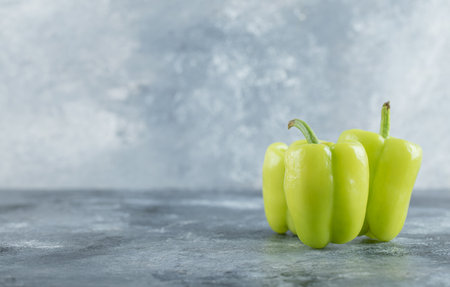 Organic fresh Green sweet pepper on grey background