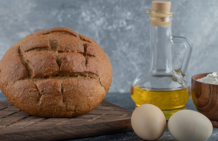 Close up photo of rye bread with egg and oil