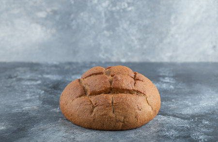 Freshly baked homemade artisan sourdough rye and white flour bread.