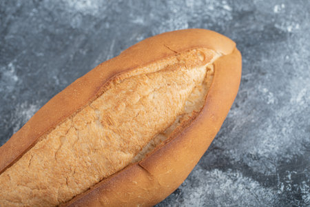 Close up photo of loaf of bread on grey backgroundの写真素材