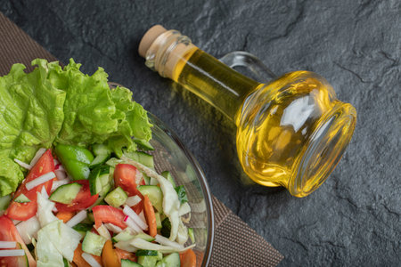 Homemade mixed salad on table for lunch on black backgroundの写真素材