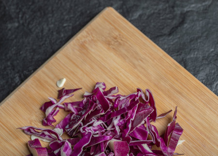 Chopped cabbage slices on the wooden cutting boardの写真素材