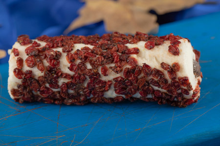 Sweet dessert with dried fruit on a wooden blue boardの写真素材